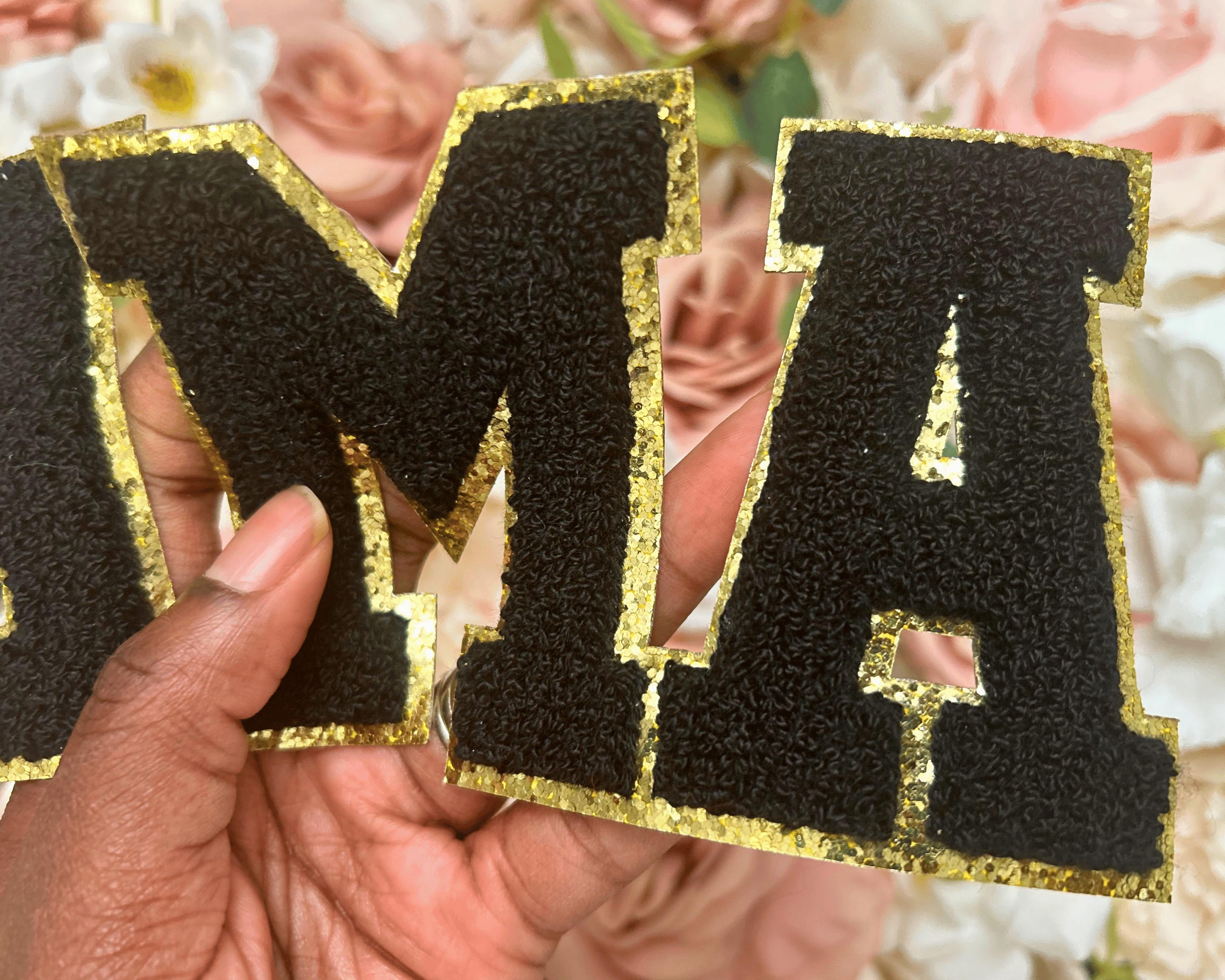 Black and gold letter &