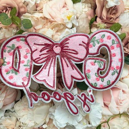 Decorative patch with floral design and text on a floral background