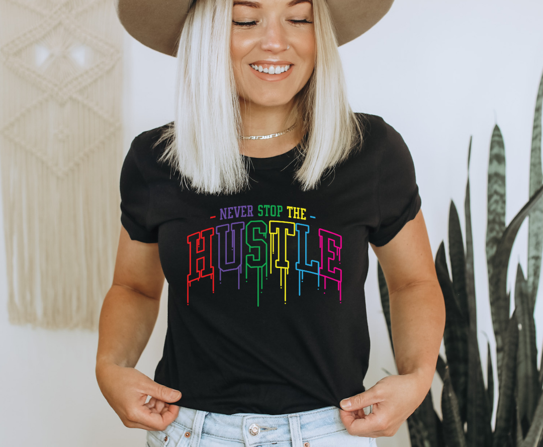 Never Stop The Hustle design printed on soft cotton tee and sweatshirt, featuring motivational graphic tee