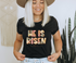 He Is Risen design printed on soft cotton tee and sweatshirt, featuring motivational graphic tee