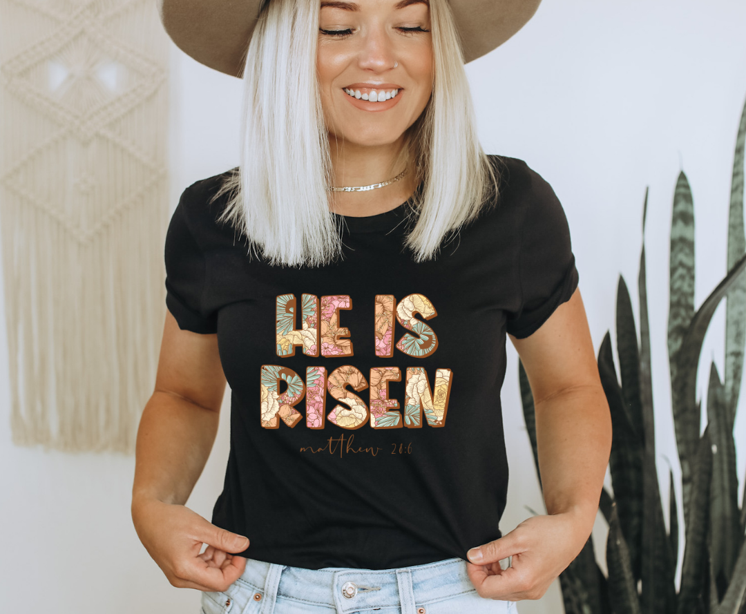 He Is Risen design printed on soft cotton tee and sweatshirt, featuring motivational graphic tee