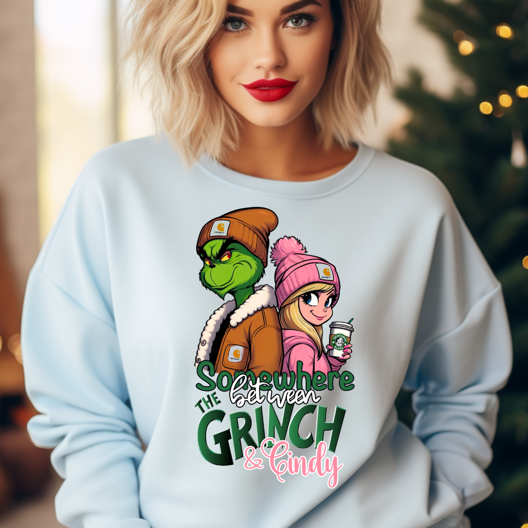 Cindy Grinch design printed on soft cotton tee and sweatshirt, featuring motivational graphic tee