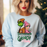 Cindy Grinch design printed on soft cotton tee and sweatshirt, featuring motivational graphic tee