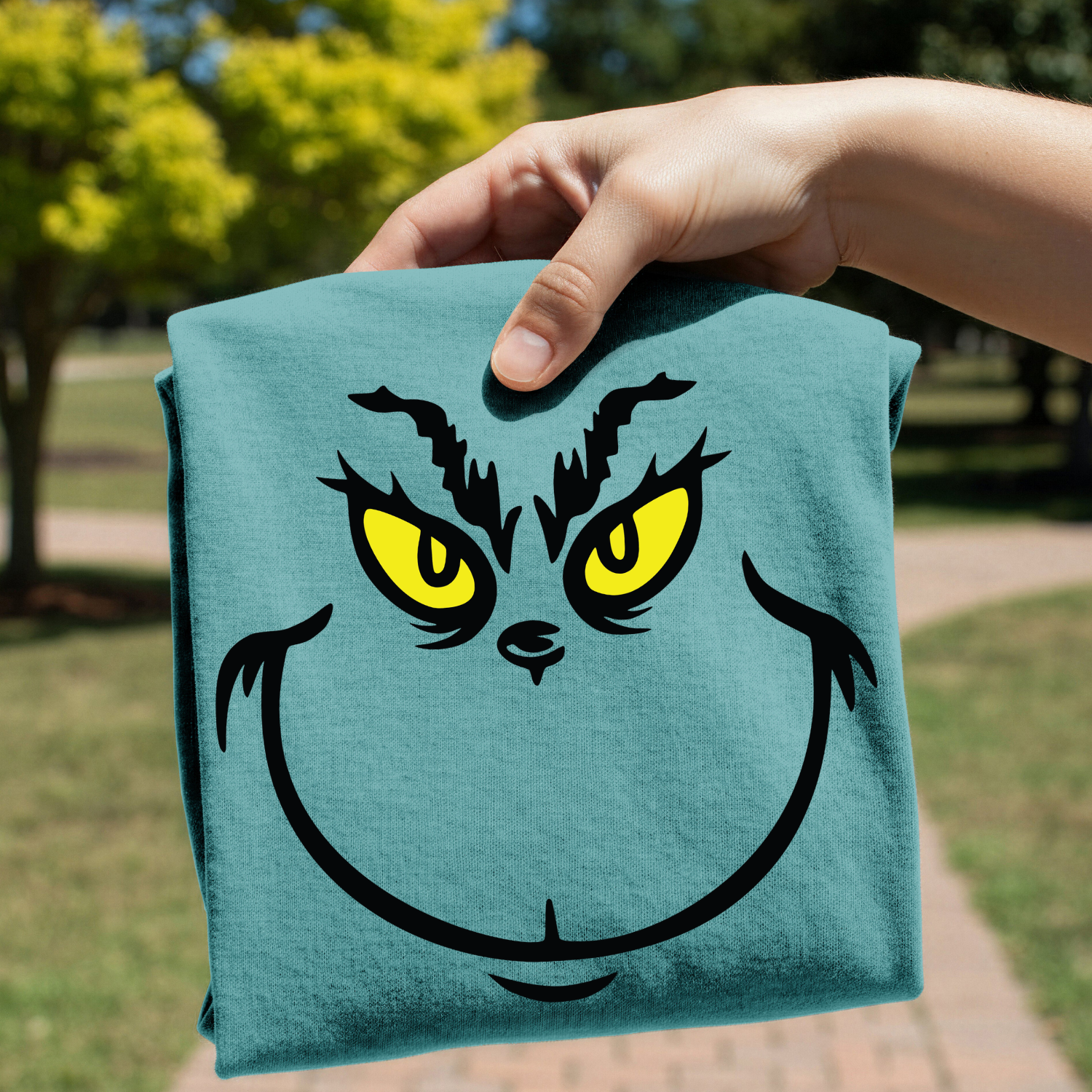 Grinch face design on shirt