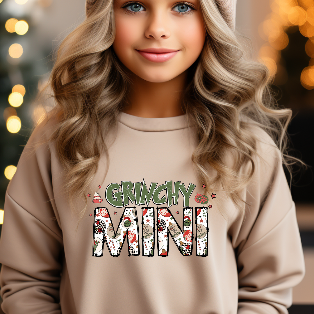 Grinchy Mini design printed on soft cotton tee and sweatshirt, featuring motivational graphic tee