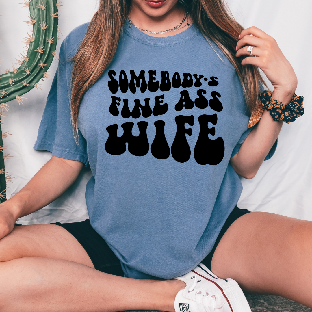 Someones Fine Ass Wife design printed on soft cotton tee and sweatshirt, featuring motivational graphic tee