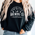 North Pole Brewing Co design printed on soft cotton tee and sweatshirt, featuring motivational graphic tee