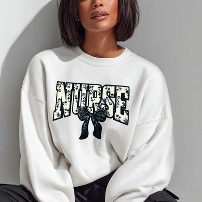 Person wearing a white sweatshirt with &