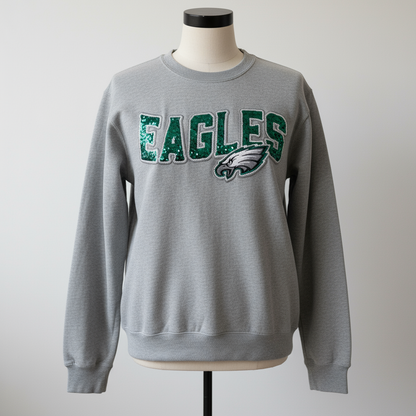 Eagles Patch on Front of Gray Sweatshirt