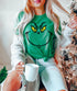 Grinch Face design printed on soft cotton tee and sweatshirt, featuring motivational graphic tee