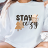 Stay Cozy 3D Puff design printed on soft cotton tee and sweatshirt, featuring motivational graphic tee