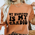 My Husband Is My Cardio design printed on soft cotton tee and sweatshirt, featuring motivational graphic tee