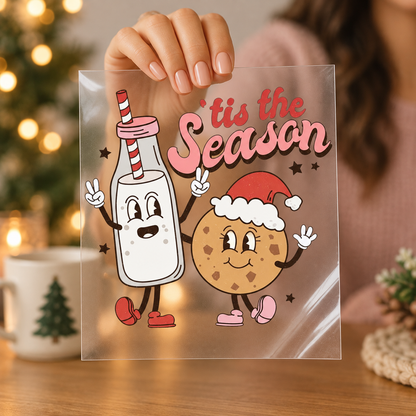 Tis The Season milk and cookie clear screen print transfer held in hand